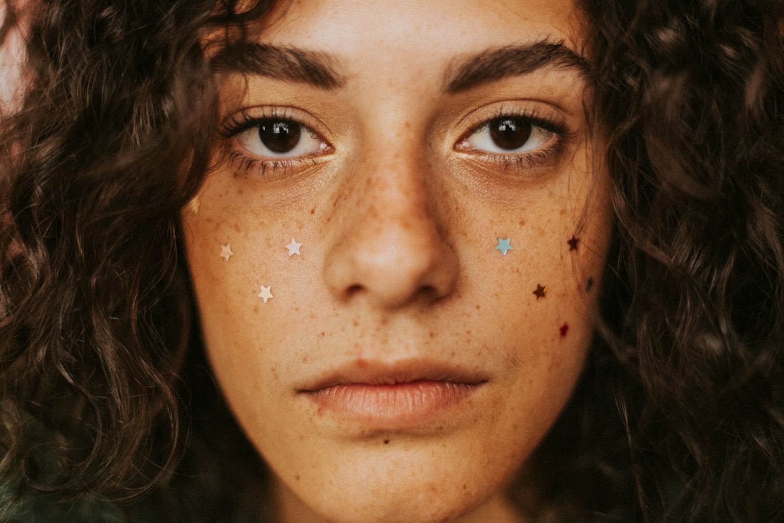 a close up of a woman with freckles on her face